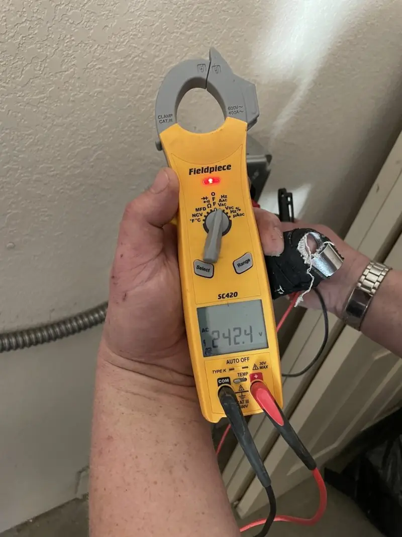 Voltage testing with clamp meter during Outlet Installation in Cresskill